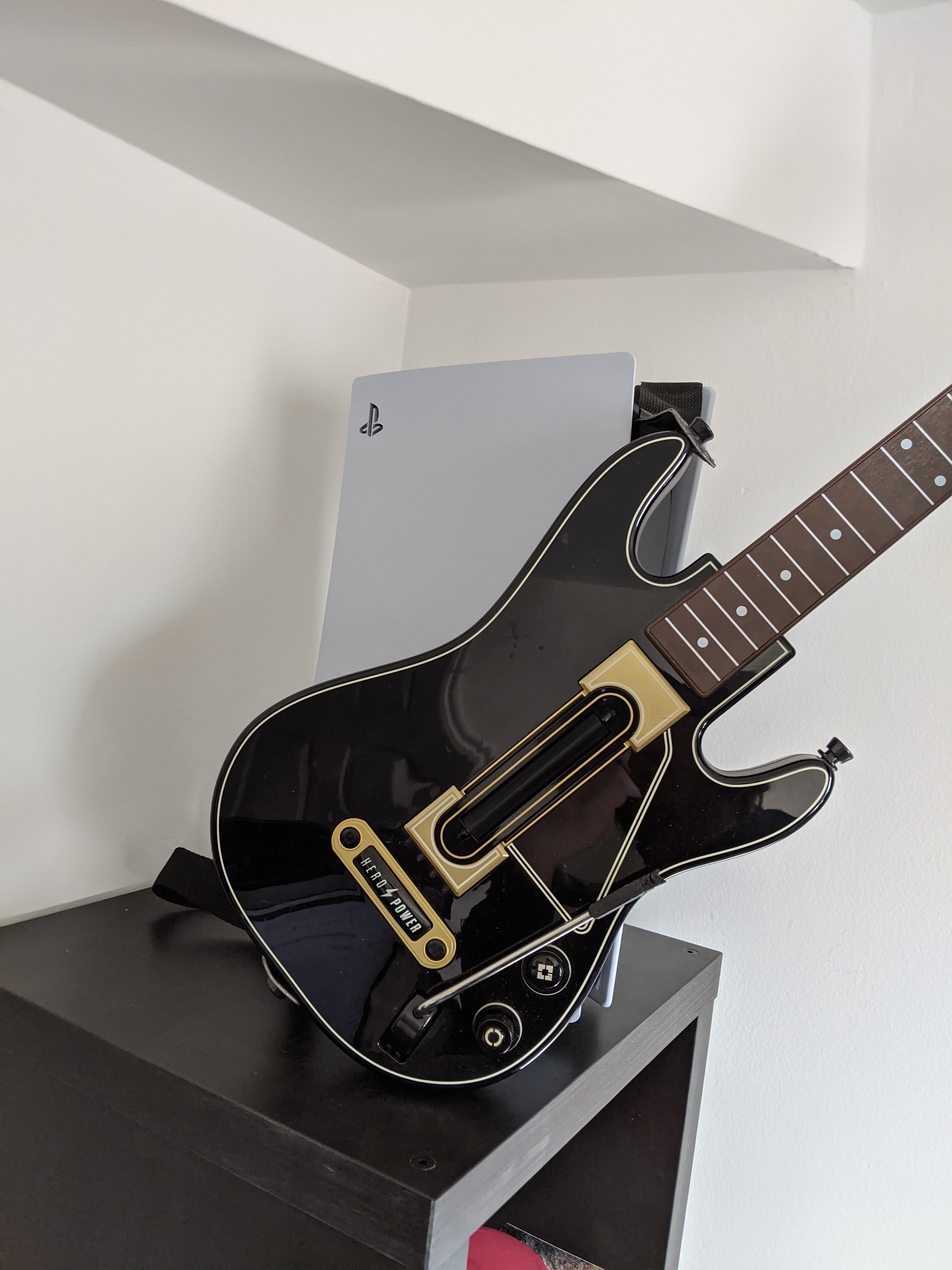 PS5 Next to a Guitar Hero Live Guitar